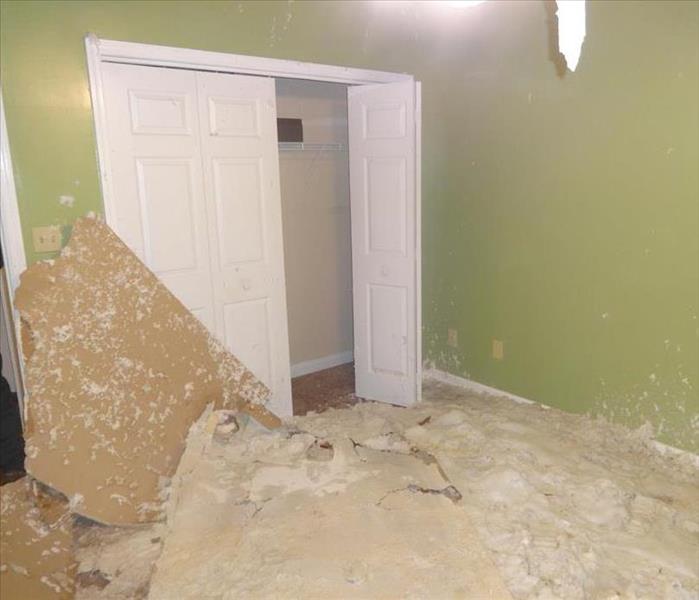 Debris from fallen drywall ceiling and insulation